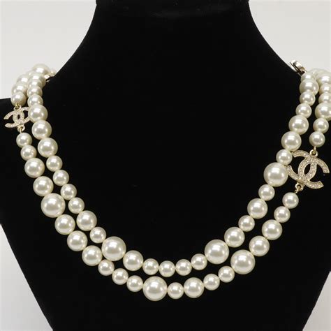 chanel button necklace|Chanel double strand perl necklace.